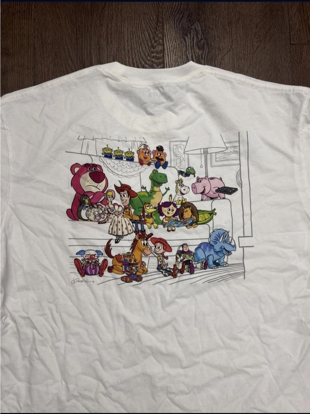 Uniqlo White Short Sleeve Tee with Colorful Toy Story Character Art